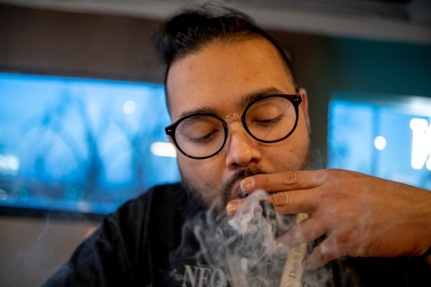 David Medina smokes a joint at ...
