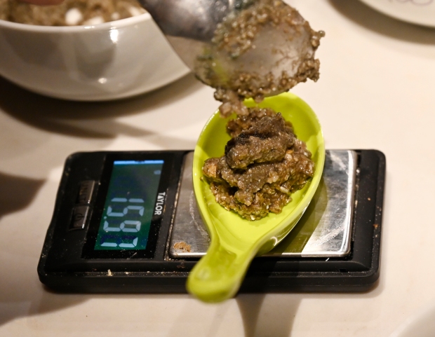 Rabbi Ben Gorelick, measures out a precise amount Sacrament, psilocybin...