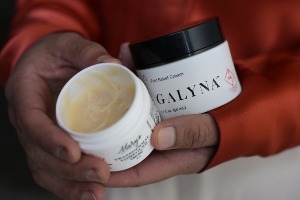 DENVER, CO - OCTOBER 27 : Owner Rebecca Marroquin shows Relief Transdermal Compound - 1:1 CBD:THC, left, and GALYNA Pain Relief Cream. 50mg CBD/50mg THC at the construction site of Pure Elevations Spa & Garden, 185 S. Santa Fe Dr., in Denver, Colorado on Friday, October 27, 2023. (Photo by Hyoung Chang/The Denver Post)