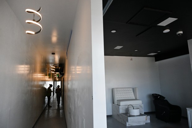 The Pure Elevations salon flanks a hallway that leads to...