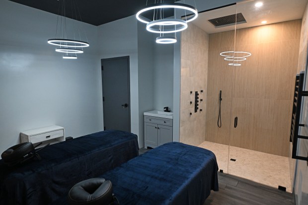 A large shower and comfortable massage tables in the couple’s...