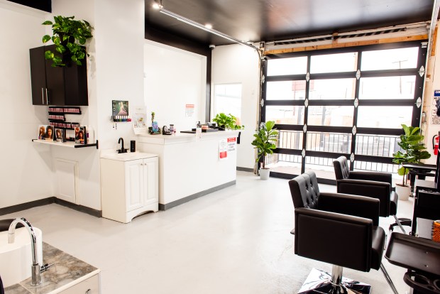 When guests arrive at Pure Elevations Canna-Spa in Denver, they will have their IDs checked and then be escorted to a small salon with a dispensary counter. They can purchase marijuana and then smoke it on the consumption patio (behind the garage door) before their massage. (Provided by Iris MacKinnon Photography)