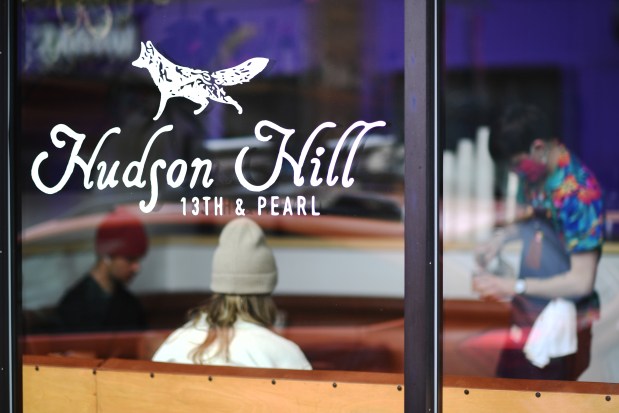 DENVER, CO - MARCH 12 : Coleman Sisk, right, takes care of customers at Hudson Hill, a coffee shop and bar, in Denver, Colorado on Friday, March 12, 2021. (Photo by Hyoung Chang/The Denver Post)